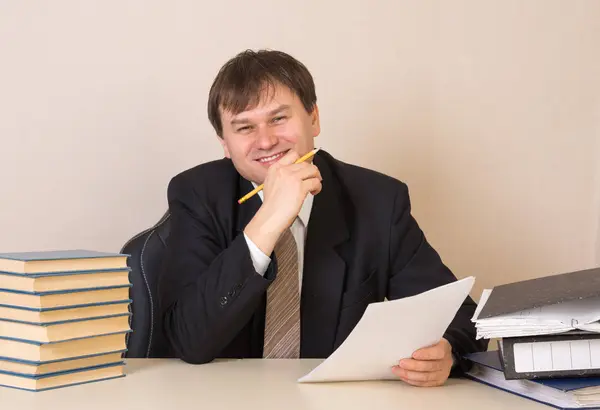 Employee with documents at the table in the office Royalty Free Stock Photos