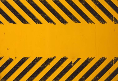 Eski sarı yıpranmış boyalı arka plan grunge siyah tehlike işareti çizgileri ve kopya alanı