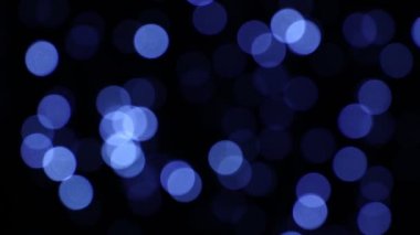 Mavi neşeli Noel ışıkları dairesel bokeh karanlık, shake üzerinde titremeye hareketli arka plan