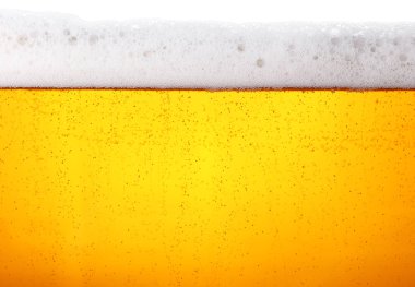 Bira köpüklü, cam köpüklü, düşük açılı, arka plan dokusunu kapat.