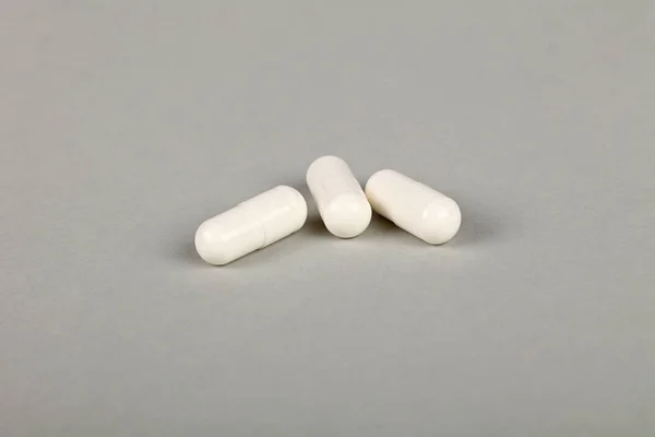 Close Three White Gel Cap Pills Medicine Grey Background Copy — Stock Photo, Image