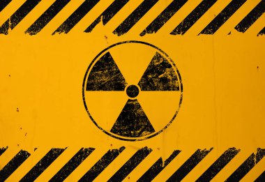 Black radioactive sign over yellow background clipart