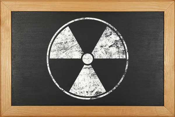 White radioactive sign over black background — Stock Photo, Image