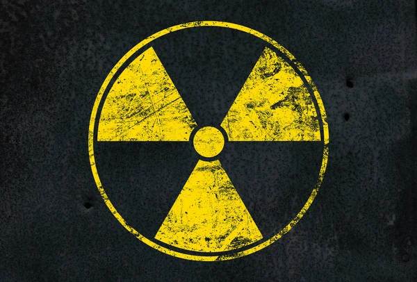 Yellow radioactive sign over black background — Stock Photo, Image