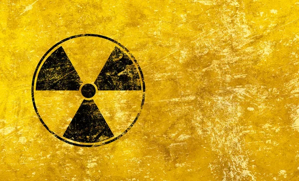 Black radioactive sign over yellow background — Stock Photo, Image