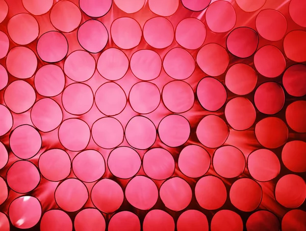 Abstrakt rosa färgglada bakgrund av stack rör — Stockfoto