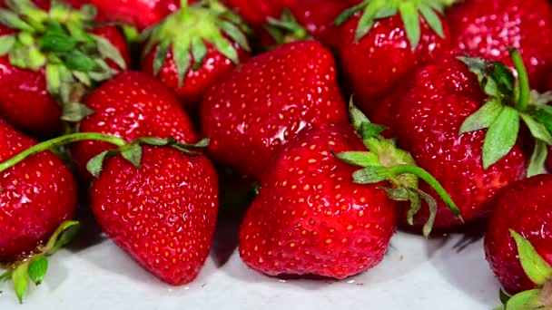 Washing red ripe strawberry with water — Stock Video