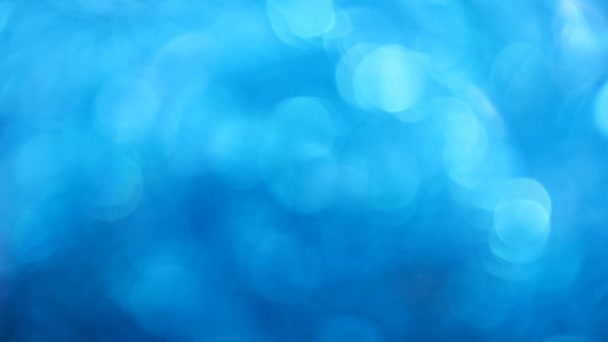 Abstracte achtergrond van blauwe bokeh glitter — Stockvideo