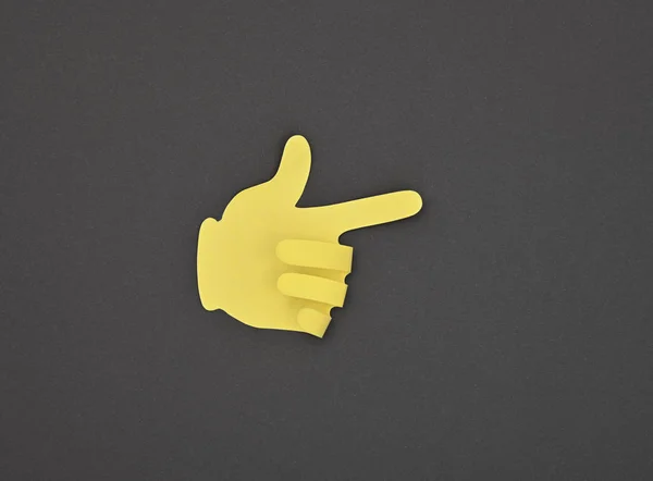 Papíron készült sárga mutató gesztus matrica szürke — Stock Fotó