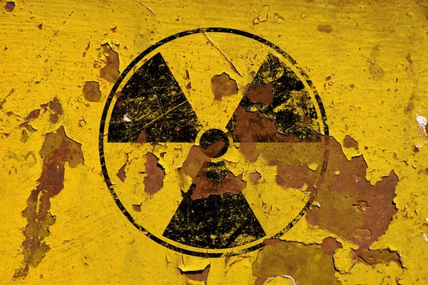 Black radioactive sign over yellow background — Stock Photo, Image