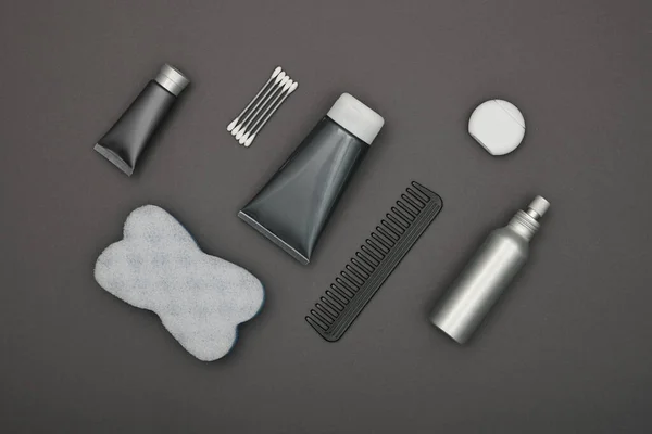 Close up flat lay of men grooming, hygiene or beauty care products over grey background, elevated top view, directly above