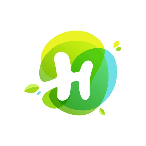 Letter H logo at green watercolor splash background. — Stock Vector