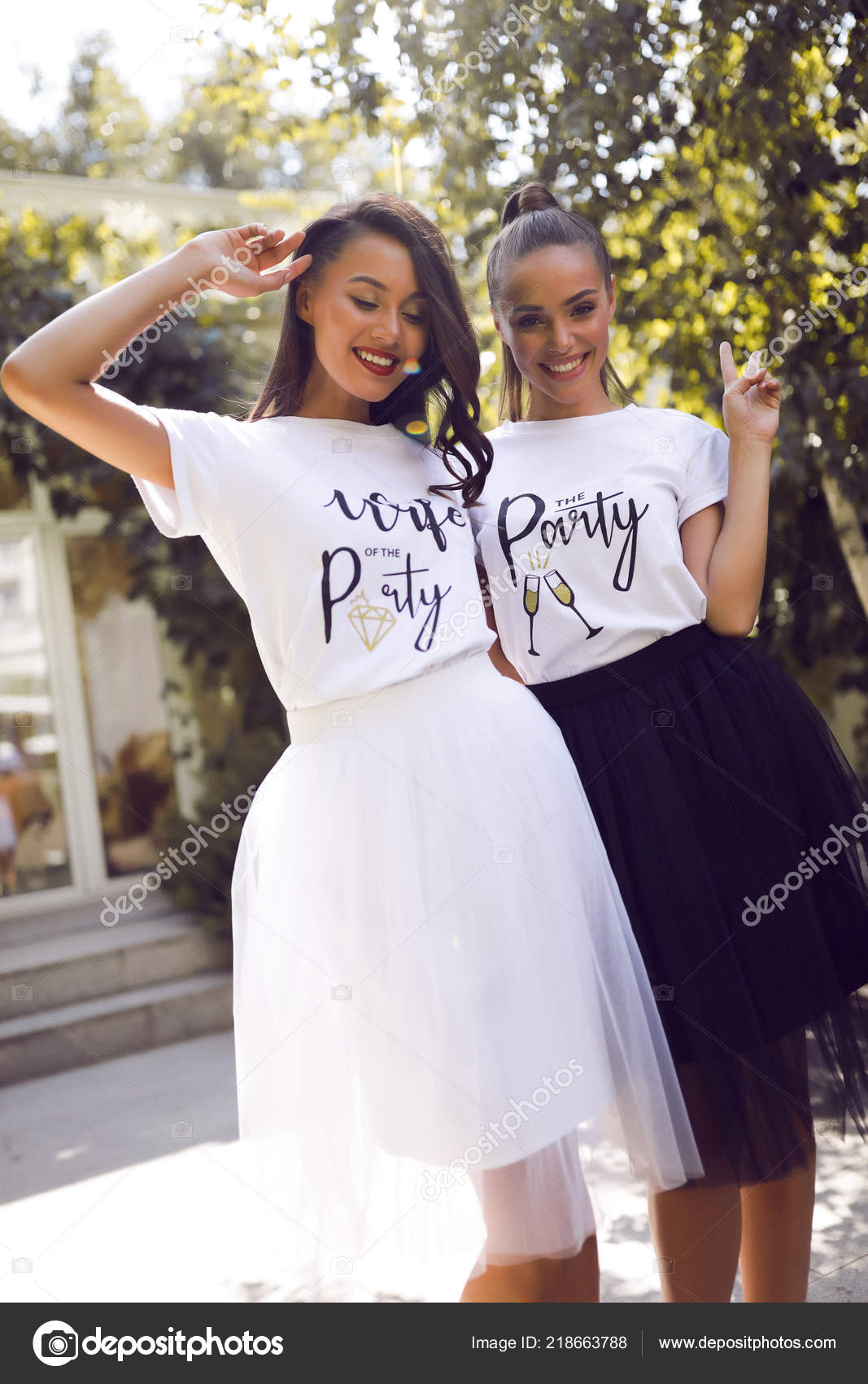 Two Smiling Girls Same White Shirts Black White Skirts Hair Stock Photo by  © 218663788