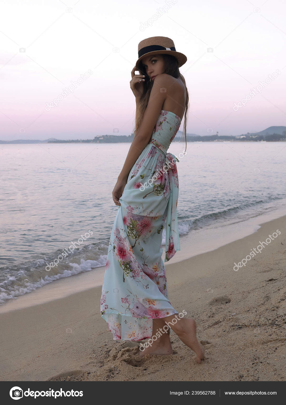 Elegant Young Caucasian Female Model Posing at the Beach in a Beautiful  Yellow Dress with Floral Patterns Stock Image - Image of beautiful, dress:  195109731
