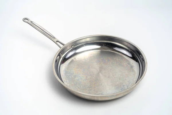 Large metal frying pan, isolated steel with handle — Stock Photo, Image