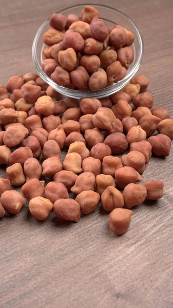 Black Chickpeas or Kala Chana with isolated on wooden Background.