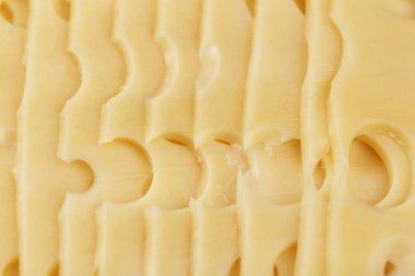 büyük delikli peynir olarak arka plan, dilimlenmiş kapat-u