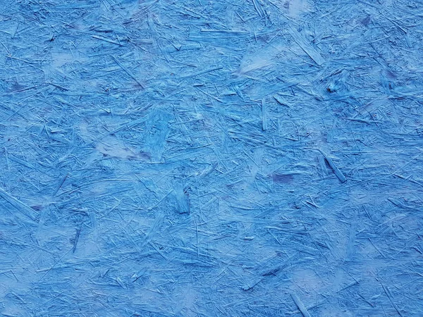 blue textured plywood background. well visible rough textur