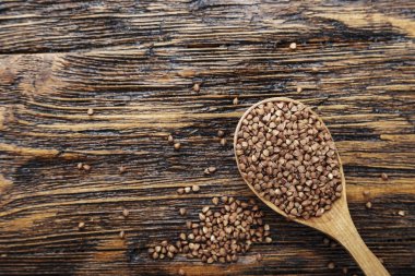 Ham buğday bir tahta kaşık tablo. tex için yer