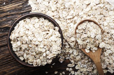 çiğ yulaf ezmesi arka plan olarak dağılmış. Yulaf ezmesi breakfas yemek