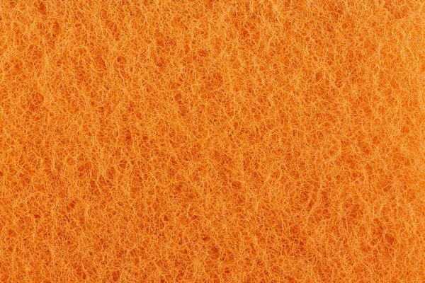 orange loofah close-up place for text. accessories for cleaning of premise
