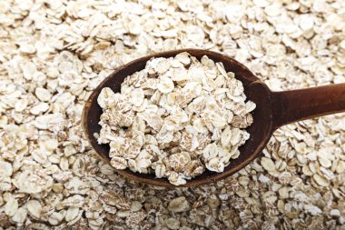 çiğ yulaf gevreği arka plan olarak dağılmış. Sağlıklı karbonhidrat kahvaltı. tex için alan