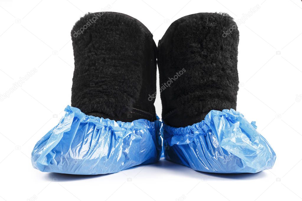 winter boots in boot covers