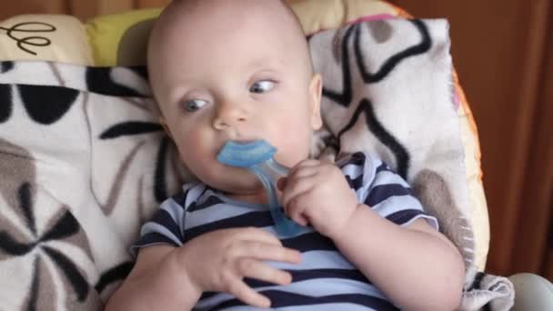 Baby boy with teether — Stock Video
