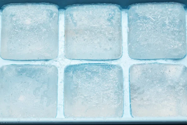 Plastic ice cube tray with frost — Stock Photo, Image