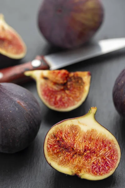Fresh ripe figs in on a dark background. Healthy food.