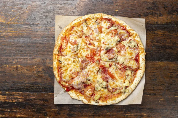 Delicious, freshly baked pizza. Fast food delivery. Bad but tasty food. Space for text or copy space. Restaurant menu advertise. Pizza menu.