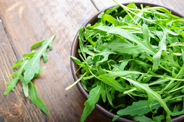 Fresh arugula leaves, rucola. Vegan food.
