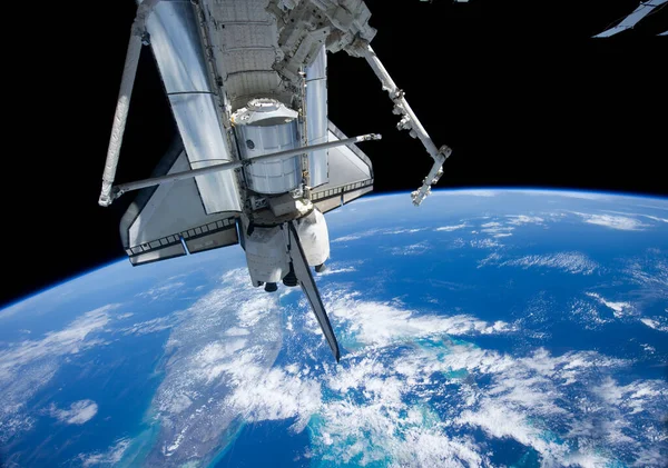 Satellite view. Space shuttle over the Florida . Elements of this image furnished by NASA.