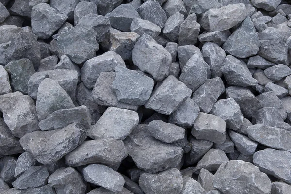 Kruszony kamień materiałów budowlanych. Zmiażdżony kamień tekstury ciemny — Zdjęcie stockowe