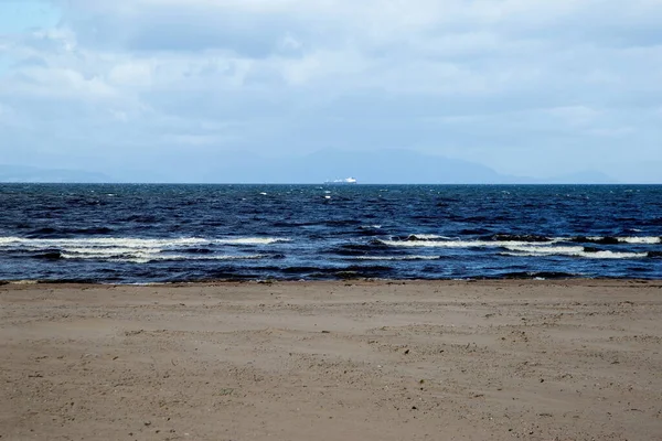 Distant Cargo Ship Viewed Deserted Coastal Beach — Stock Photo, Image