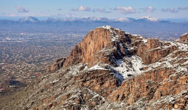 Snow in the Catalina Mountains, looking down on Tucson, Arizona. clipart