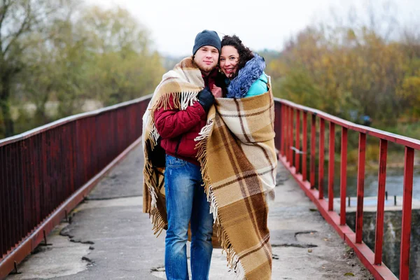 Young Couple Embraced Standing Bridge Covered Plaid Autumn — Stock Photo, Image