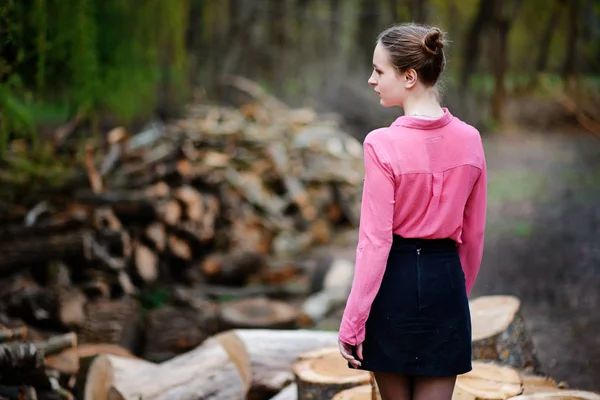 Beautiful Young Woman Sitting Stack Felled Tree Trunks Forest — Stock Photo, Image