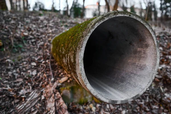 sewage pipe acts on the ground, background