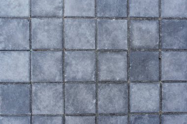 Beton parke doku, üstten görünüm kiremitli gri kare plaka şeklinde.