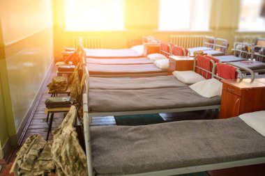 many beds in the military barracks of ukraine. clipart