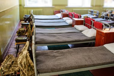 many beds in the military barracks of ukraine. clipart
