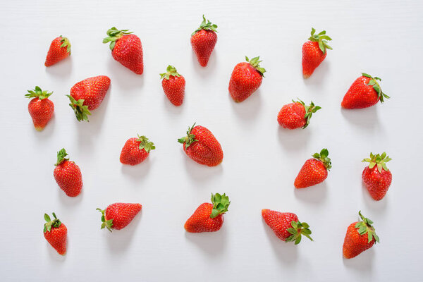 Fresh strawberry. Strawberries on white concrete background. Harvest of organic local strawberries.