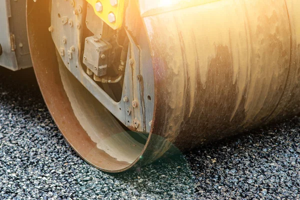 Background of asphalt roller that stack and press hot asphalt. Road repair machine.