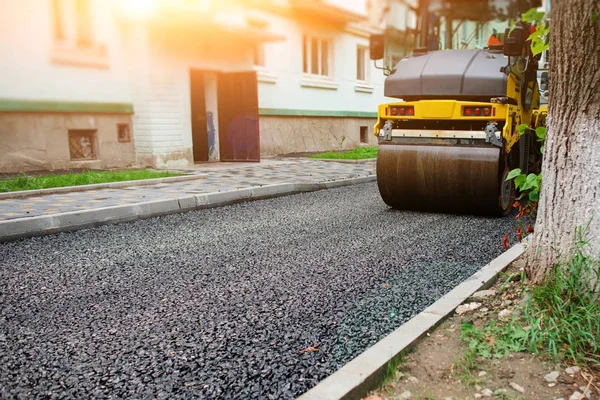 Background of asphalt roller that stack and press hot asphalt. Road repair machine.