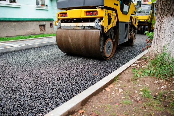 Background of asphalt roller that stack and press hot asphalt. Road repair machine.