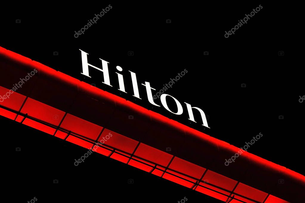 BELGRADE, SERBIA - MARCH 10, 2018 Hilton hotel logo on top of building at night in Belgrade, Serbia
