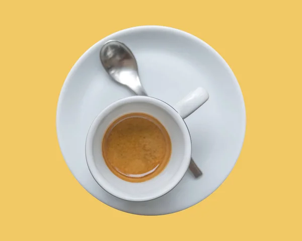 Perfect cup of espresso in white cup isolated on yellow background