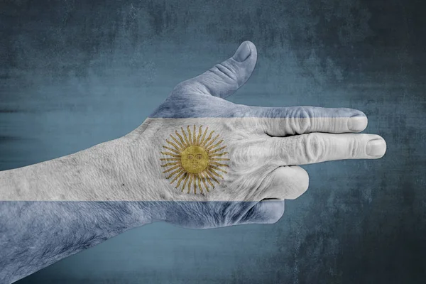 Σημαία Της Αργεντινής Ζωγραφισμένα Στο Ανδρικό Χέρι Όπως Ένα Πυροβόλο — Φωτογραφία Αρχείου