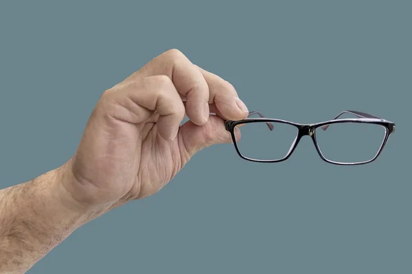 Hand Hält Brille Isoliert Auf Grünem Pastellhintergrund — Stockfoto
